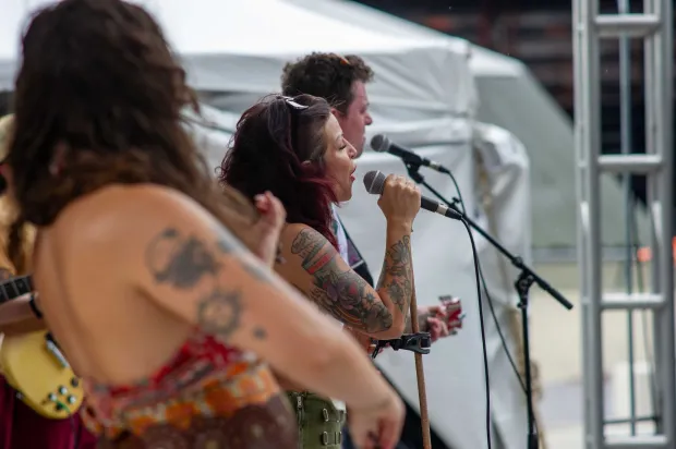 Festivalgoers enjoy food, music, and the atmosphere as they gather ahead of the evening's headlining performance during Musikfest on Sunday, Aug. 2, 2026, in Bethlehem. The annual festival runs through Aug. 9. (Jonathan Broady/Special to The Morning Call)