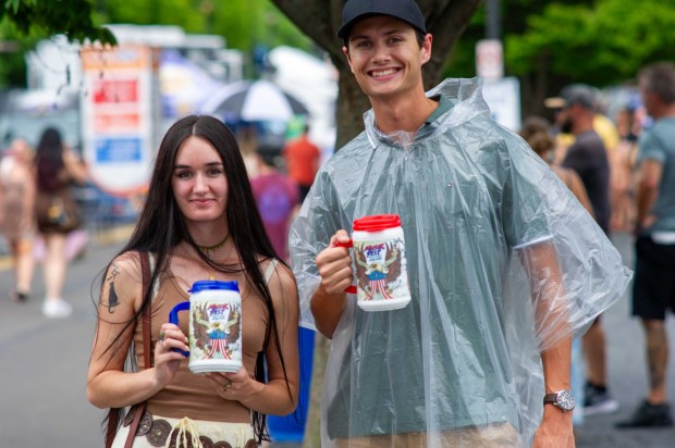 Festivalgoers enjoy food, music, and the atmosphere as they gather ahead of the evening's headlining performance during Musikfest on Sunday, Aug. 2, 2026, in Bethlehem. The annual festival runs through Aug. 9. (Jonathan Broady/Special to The Morning Call)