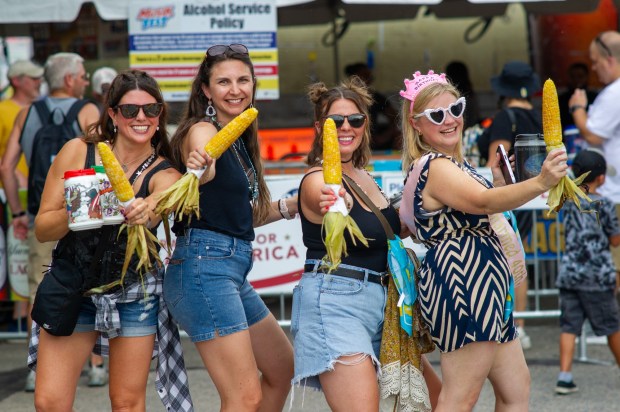 Festivalgoers enjoy food, music, and the atmosphere as they gather ahead of the evening's headlining performance during Musikfest on Sunday, Aug. 2, 2026, in Bethlehem. The annual festival runs through Aug. 9. (Jonathan Broady/Special to The Morning Call)