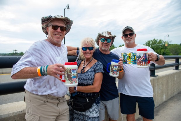 Festivalgoers enjoy food, music, and the atmosphere as they gather ahead of the evening's headlining performance during Musikfest on Sunday, Aug. 2, 2026, in Bethlehem. The annual festival runs through Aug. 9. (Jonathan Broady/Special to The Morning Call)
