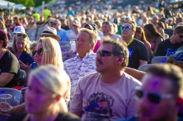 Festivalgoers enjoy food, music, and the atmosphere as they gather ahead of the evening's headlining performance during Musikfest on Monday, Aug. 3, 2026, in Bethlehem. The annual festival runs through Aug. 9. (Jonathan Broady/Special to The Morning Call)