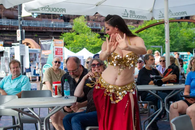 Festivalgoers enjoy food, music, and the atmosphere as they gather ahead of the evening's headlining performance during Musikfest on Monday, Aug. 3, 2026, in Bethlehem. The annual festival runs through Aug. 9. (Jonathan Broady/Special to The Morning Call)