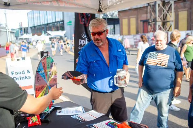 Festivalgoers enjoy food, music, and the atmosphere as they gather ahead of the evening's headlining performance during Musikfest on Monday, Aug. 3, 2026, in Bethlehem. The annual festival runs through Aug. 9. (Jonathan Broady/Special to The Morning Call)