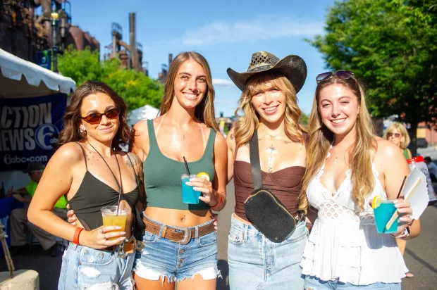 Festivalgoers enjoy food, music, and the atmosphere as they gather ahead of the evening's headlining performance during Musikfest on Monday, Aug. 3, 2026, in Bethlehem. The annual festival runs through Aug. 9. (Jonathan Broady/Special to The Morning Call)