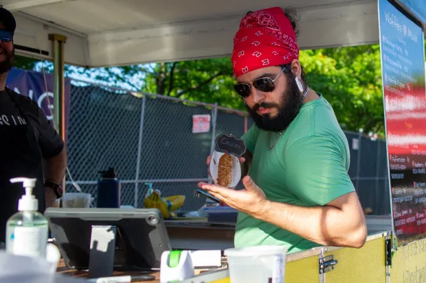 Festivalgoers enjoy food, music, and the atmosphere as they gather ahead of the evening's headlining performance during Musikfest on Monday, Aug. 3, 2026, in Bethlehem. The annual festival runs through Aug. 9. (Jonathan Broady/Special to The Morning Call)