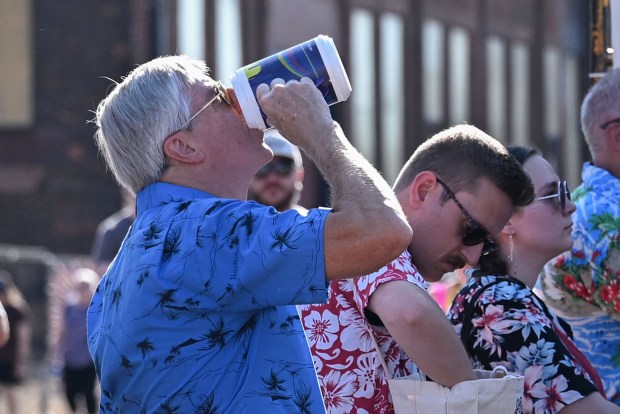 Festivalgoers enjoy food, music, and the atmosphere as they gather ahead of the evening's headlining performance during Musikfest on Tuesday, Aug. 4, 2026, in Bethlehem. The annual festival runs through Aug. 9. (Jon Chiu/The Morning Call)