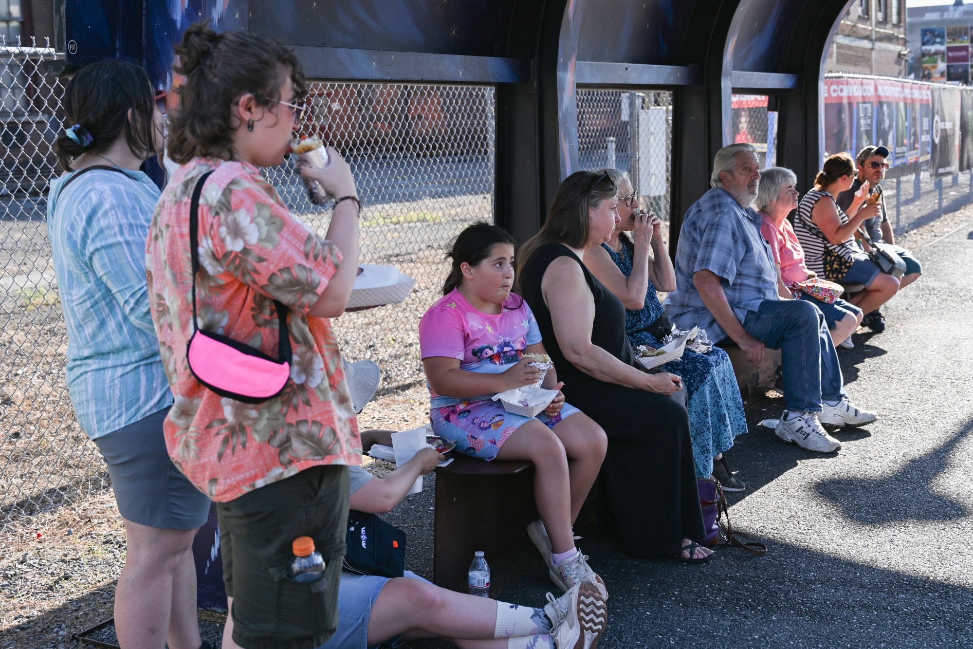 Festivalgoers enjoy food, music, and the atmosphere as they gather ahead of the evening's headlining performance during Musikfest on Tuesday, Aug. 4, 2026, in Bethlehem. The annual festival runs through Aug. 9. (Jon Chiu/The Morning Call)