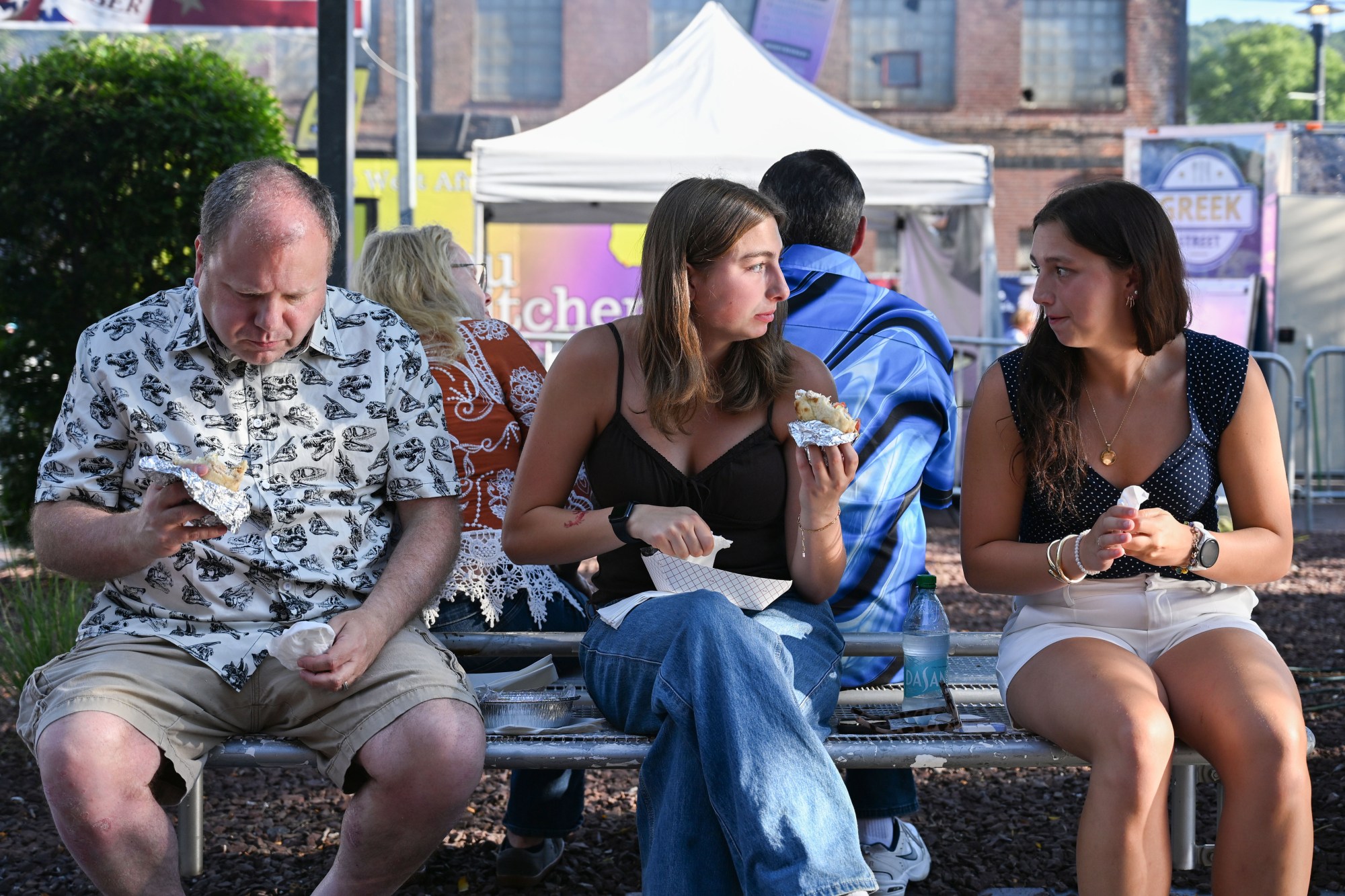 Festivalgoers enjoy food, music, and the atmosphere as they gather ahead of the evening's headlining performance during Musikfest on Tuesday, Aug. 4, 2026, in Bethlehem. The annual festival runs through Aug. 9. (Jon Chiu/The Morning Call)