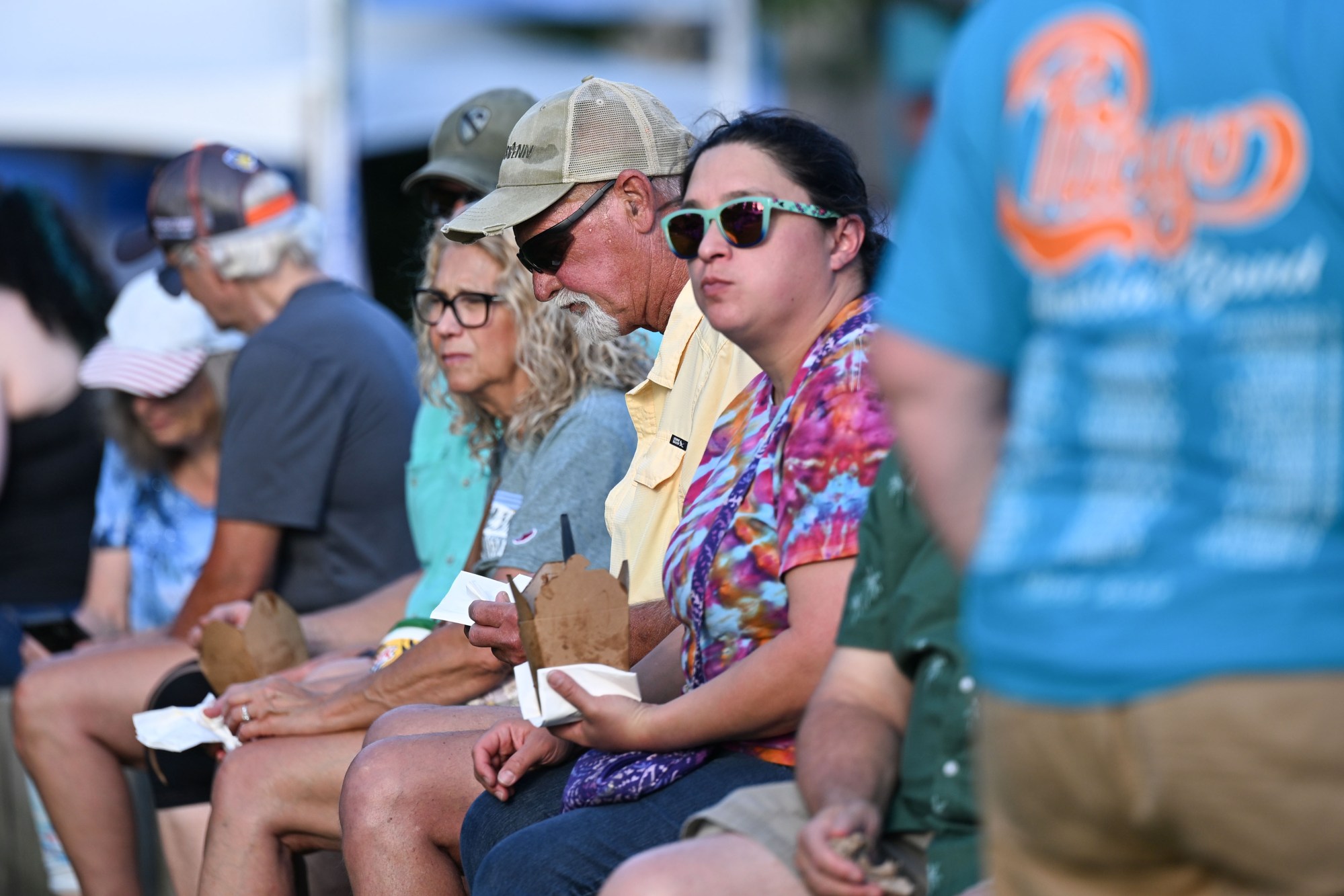 Festivalgoers enjoy food, music, and the atmosphere as they gather ahead of the evening's headlining performance during Musikfest on Tuesday, Aug. 4, 2026, in Bethlehem. The annual festival runs through Aug. 9. (Jon Chiu/The Morning Call)