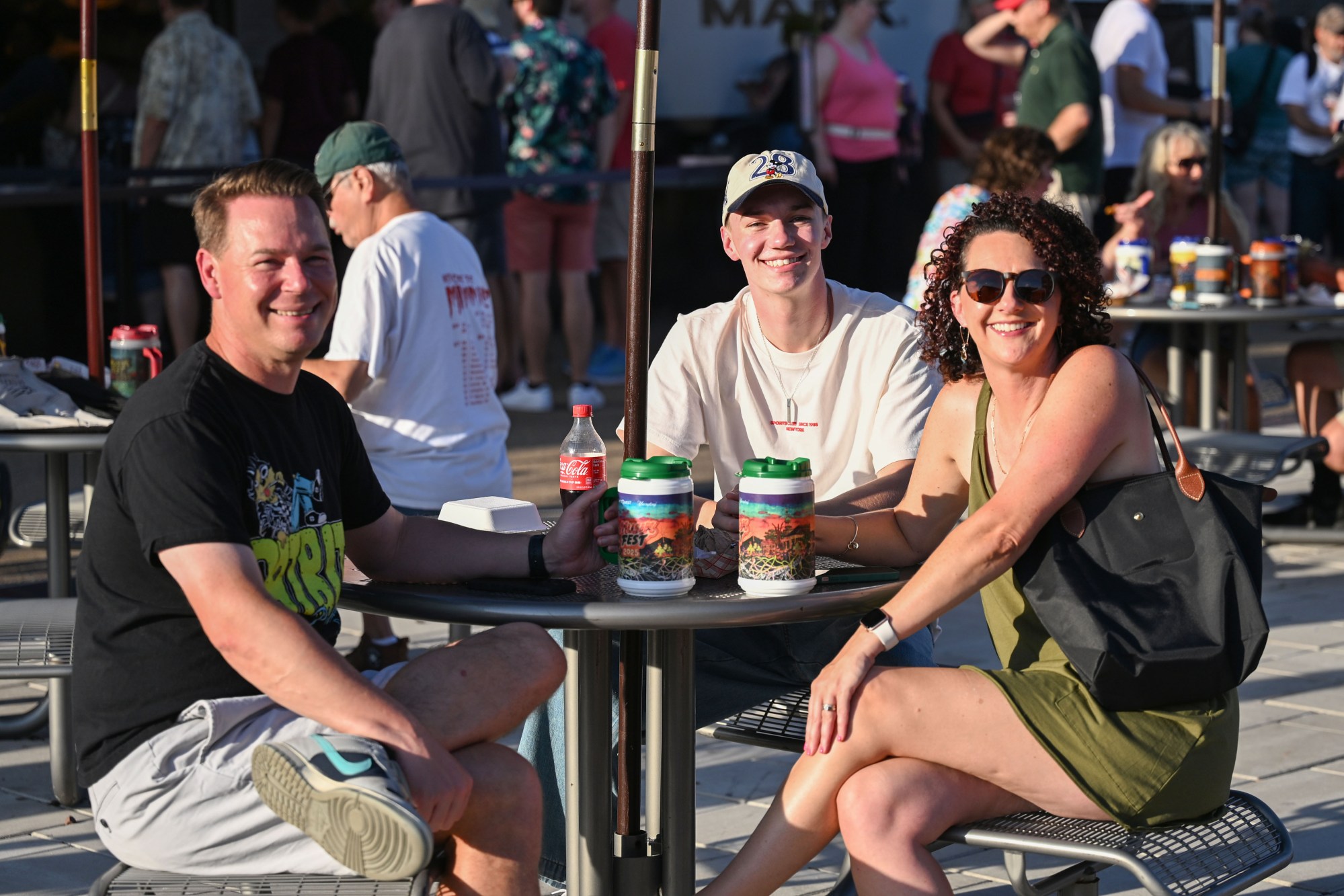 Festivalgoers enjoy food, music, and the atmosphere as they gather ahead of the evening's headlining performance during Musikfest on Tuesday, Aug. 4, 2026, in Bethlehem. The annual festival runs through Aug. 9. (Jon Chiu/The Morning Call)