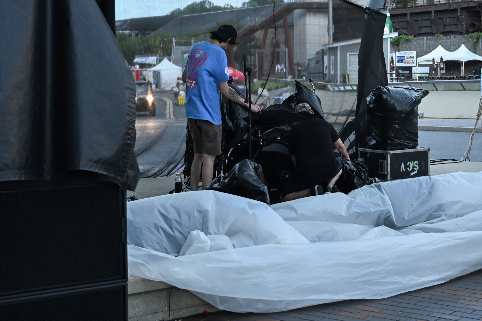 People work to secure musical instruments ahead of an incoming storm during Musikfest on Friday, Aug. 7, 2026, at the SteelStacks in Bethlehem. (Jon Chiu/The Morning Call)