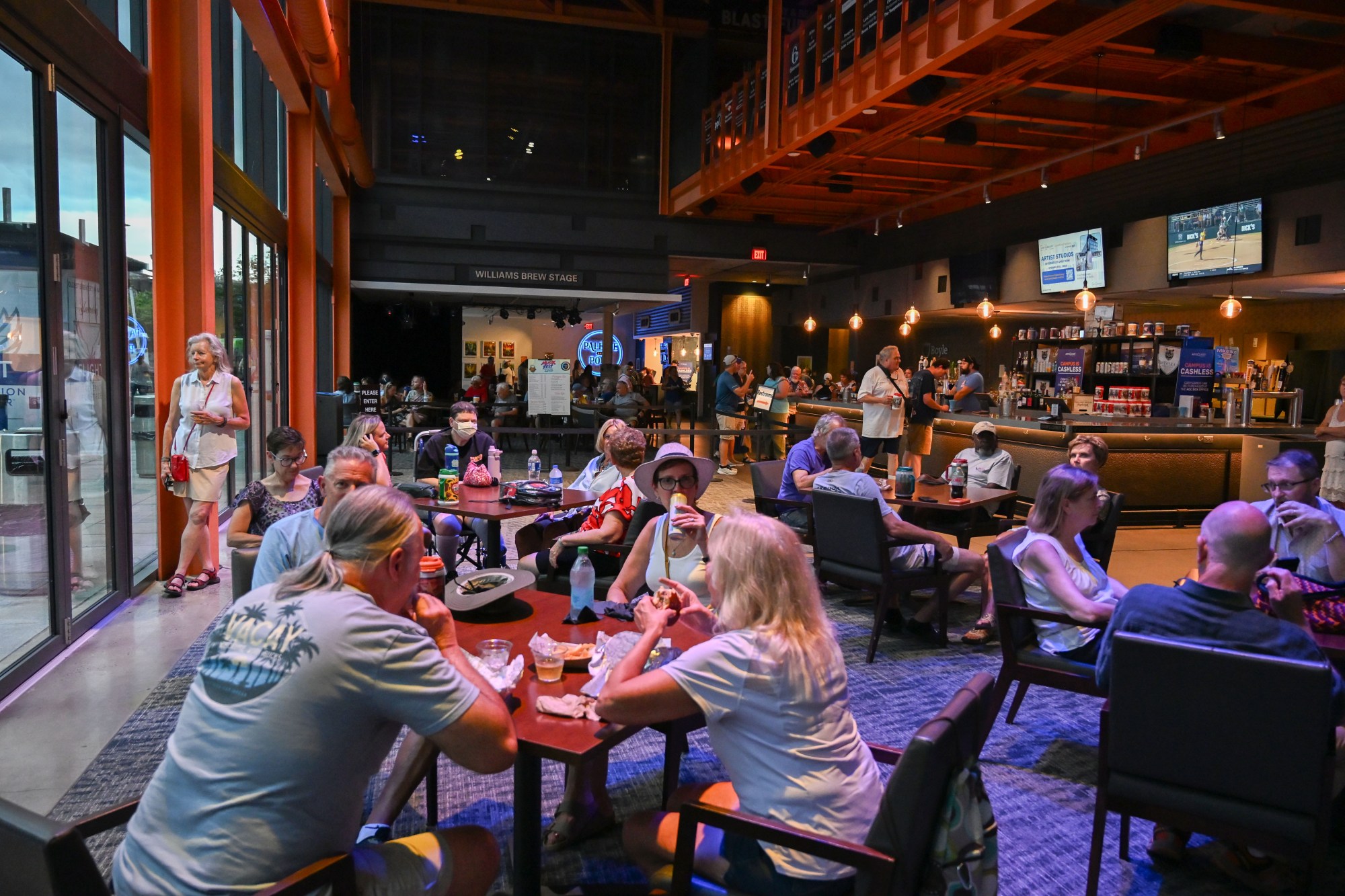 People seek shelter from a storm during Musikfest on Friday, Aug. 7, 2026, at the SteelStacks in Bethlehem. (Jon Chiu/The Morning Call)