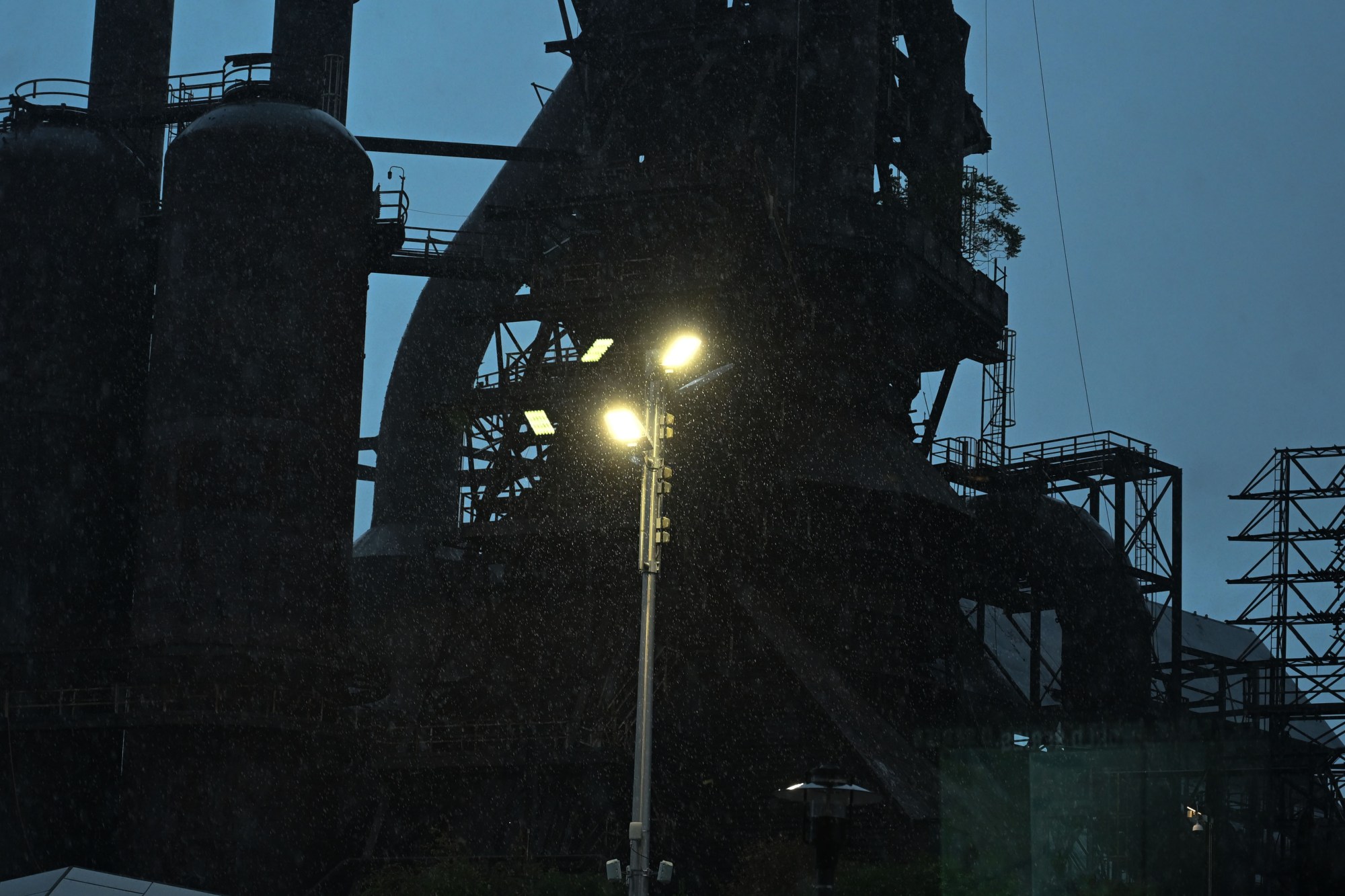 Rain pours down from a storm during Musikfest on Friday, Aug. 7, 2026, at the SteelStacks in Bethlehem. (Jon Chiu/The Morning Call)