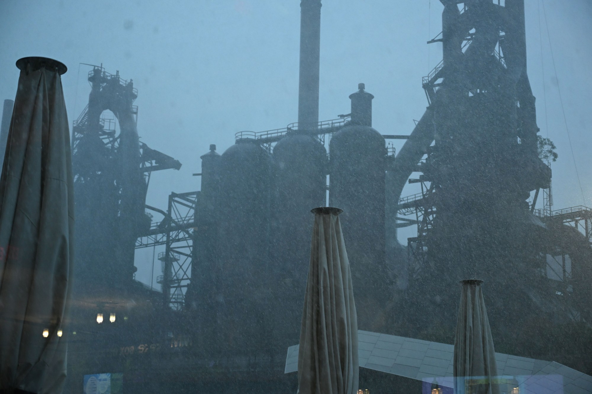 Rain pours down from a storm during Musikfest on Friday, Aug. 7, 2026, at the SteelStacks in Bethlehem. (Jon Chiu/The Morning Call)