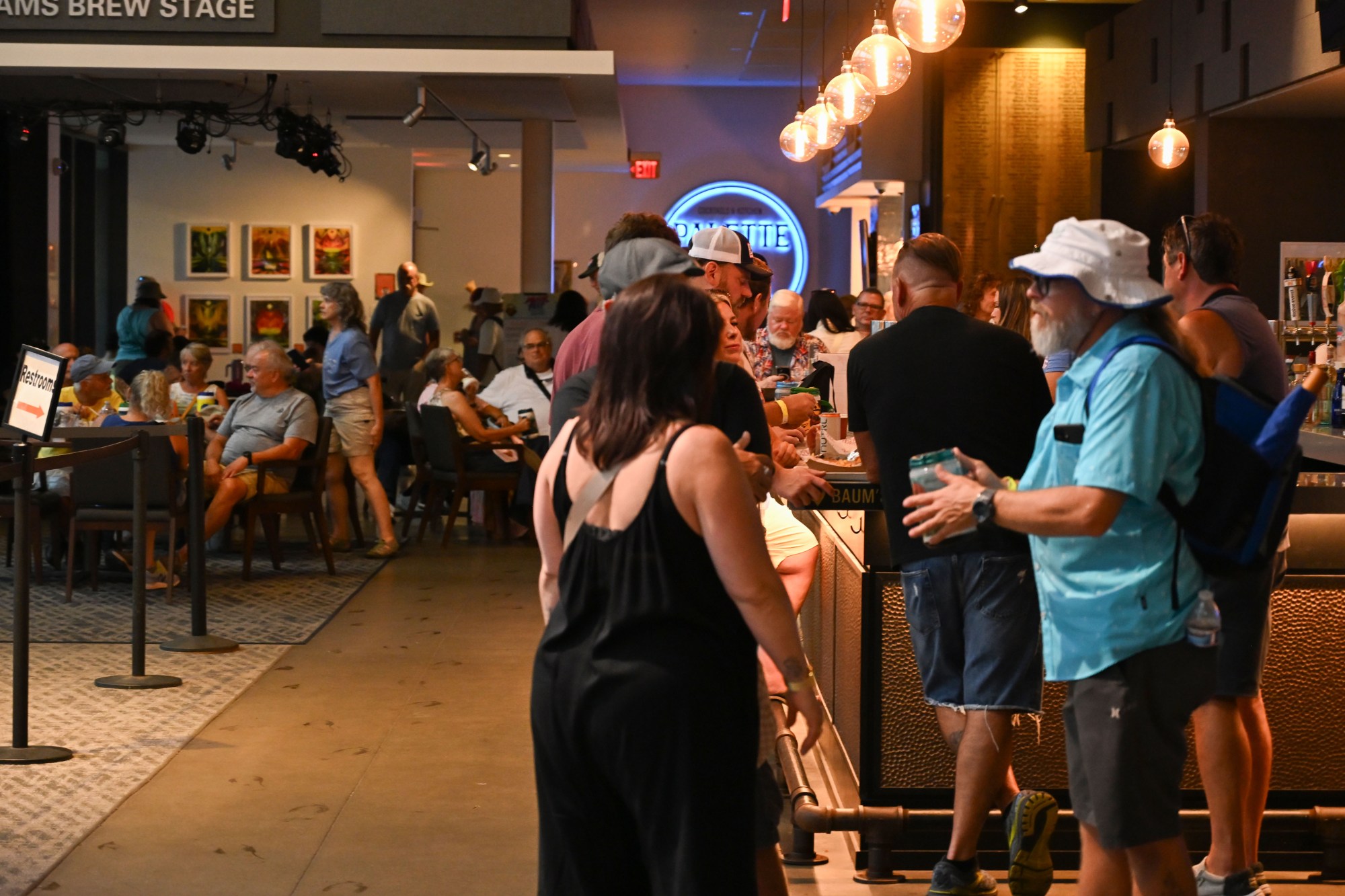 People seek shelter from a storm during Musikfest on Friday, Aug. 7, 2026, at the SteelStacks in Bethlehem. (Jon Chiu/The Morning Call)