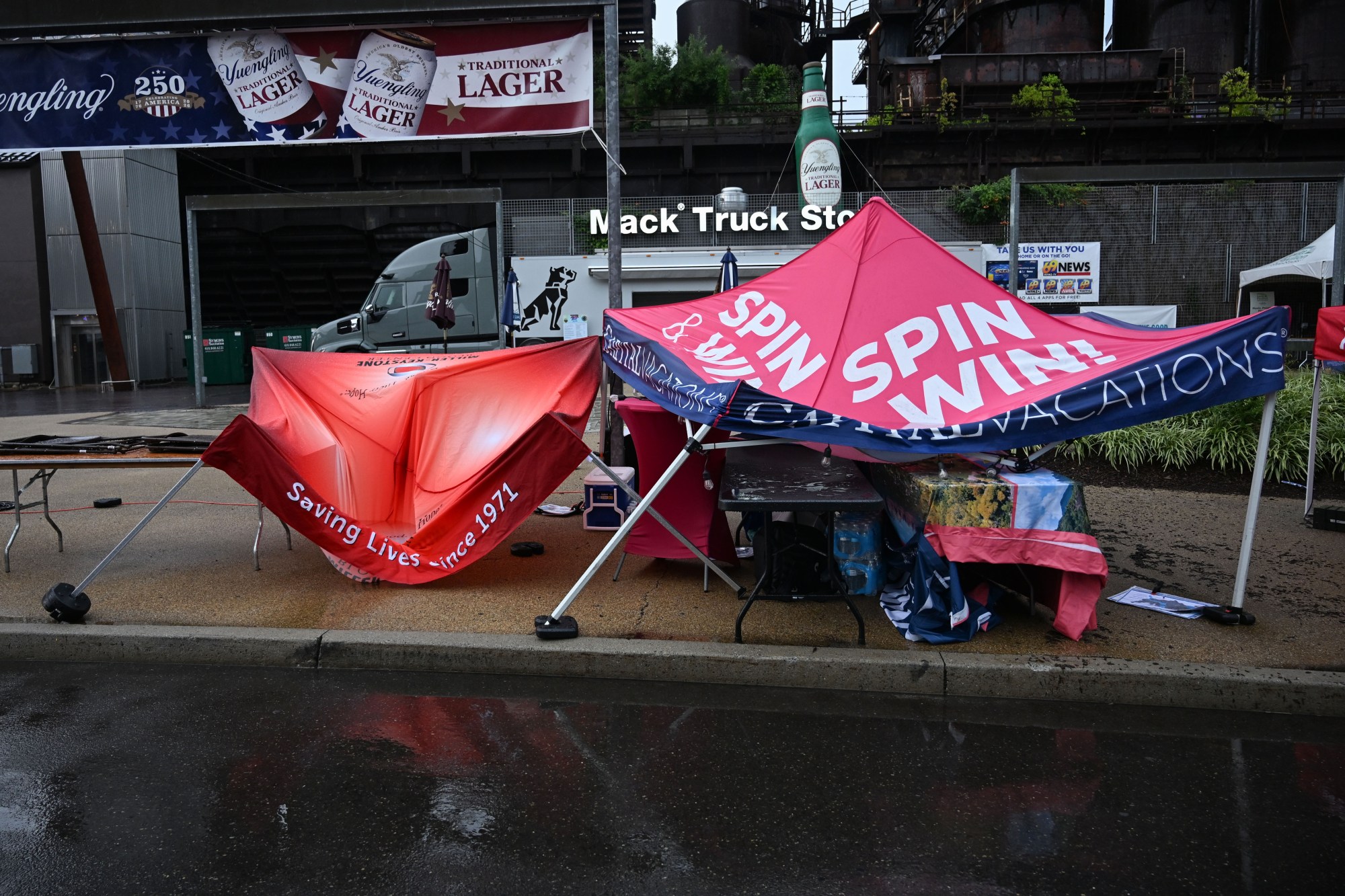 Tents are left barely standing after a passing storm on Friday, Aug. 7, 2026, at the SteelStacks in Bethlehem. (Jon Chiu/The Morning Call)