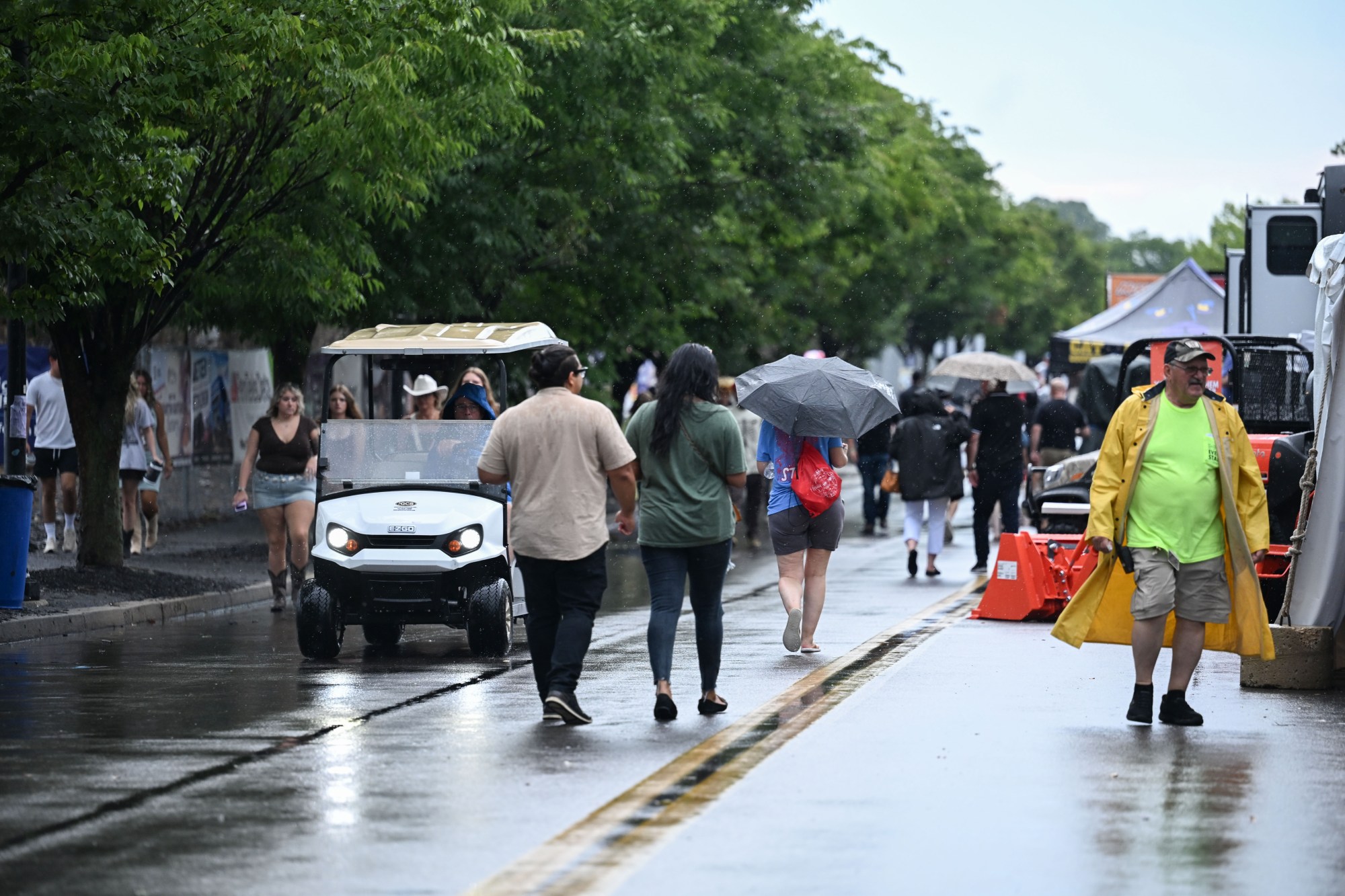 People walk around Musikfest following its temporary shutdown by a passing storm on Friday, Aug. 7, 2026, at the SteelStacks in Bethlehem. (Jon Chiu/The Morning Call)