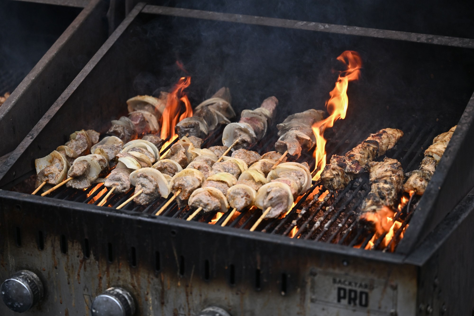 Food from Lou Kitchen cooks on a grill during Musikfest on Friday, Aug. 7, 2026, at the SteelStacks in Bethlehem. (Jon Chiu/The Morning Call)