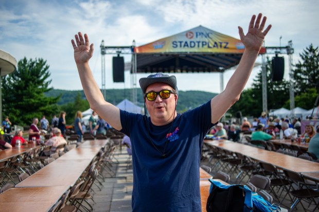Festivalgoers enjoy food, music, and the atmosphere as they gather ahead of the evening's headlining performance during Musikfest on Saturday, Aug. 8, 2026, in Bethlehem. The annual festival runs through Aug. 9. (Jonathan Broady/Special to The Morning Call)