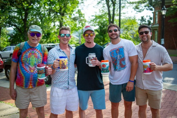 Festivalgoers enjoy food, music, and the atmosphere as they gather ahead of the evening's headlining performance during Musikfest on Saturday, Aug. 8, 2026, in Bethlehem. The annual festival runs through Aug. 9. (Jonathan Broady/Special to The Morning Call)