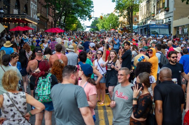 Festivalgoers enjoy food, music, and the atmosphere as they gather ahead of the evening's headlining performance during Musikfest on Saturday, Aug. 8, 2026, in Bethlehem. The annual festival runs through Aug. 9. (Jonathan Broady/Special to The Morning Call)