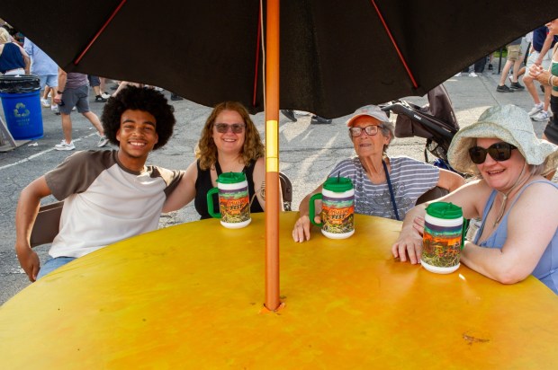 Festivalgoers enjoy food, music, and the atmosphere as they gather ahead of the evening's headlining performance during Musikfest on Saturday, Aug. 8, 2026, in Bethlehem. The annual festival runs through Aug. 9. (Jonathan Broady/Special to The Morning Call)