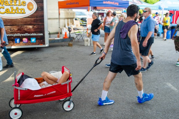 Festivalgoers enjoy food, music, and the atmosphere as they gather ahead of the evening's headlining performance during Musikfest on Saturday, Aug. 8, 2026, in Bethlehem. The annual festival runs through Aug. 9. (Jonathan Broady/Special to The Morning Call)