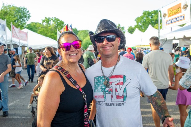 Festivalgoers enjoy food, music, and the atmosphere as they gather ahead of the evening's headlining performance during Musikfest on Saturday, Aug. 8, 2026, in Bethlehem. The annual festival runs through Aug. 9. (Jonathan Broady/Special to The Morning Call)