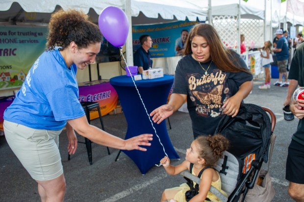 Festivalgoers enjoy food, music, and the atmosphere as they gather ahead of the evening's headlining performance during Musikfest on Saturday, Aug. 8, 2026, in Bethlehem. The annual festival runs through Aug. 9. (Jonathan Broady/Special to The Morning Call)