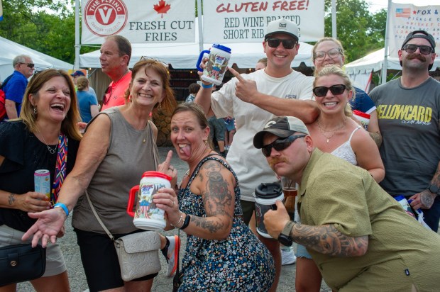 Festivalgoers enjoy food, music, and the atmosphere as they gather ahead of the evening's headlining performance during Musikfest on Saturday, Aug. 8, 2026, in Bethlehem. The annual festival runs through Aug. 9. (Jonathan Broady/Special to The Morning Call)
