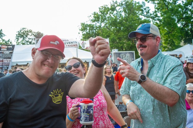 Festivalgoers enjoy food, music, and the atmosphere as they gather ahead of the evening's headlining performance during Musikfest on Saturday, Aug. 8, 2026, in Bethlehem. The annual festival runs through Aug. 9. (Jonathan Broady/Special to The Morning Call)