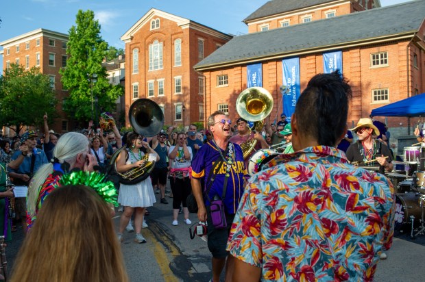 Festivalgoers enjoy food, music, and the atmosphere as they gather ahead of the evening's headlining performance during Musikfest on Saturday, Aug. 8, 2026, in Bethlehem. The annual festival runs through Aug. 9. (Jonathan Broady/Special to The Morning Call)