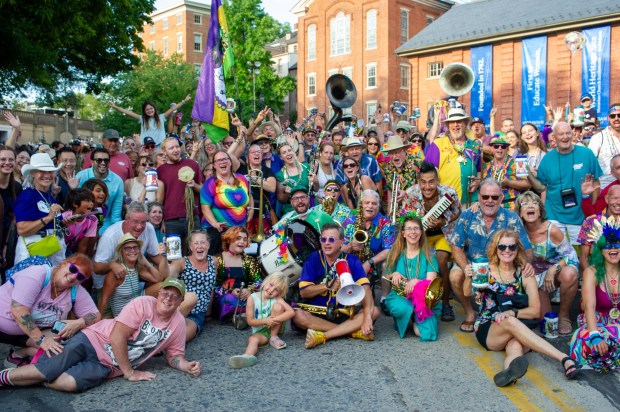 Festivalgoers enjoy food, music, and the atmosphere as they gather ahead of the evening's headlining performance during Musikfest on Saturday, Aug. 8, 2026, in Bethlehem. The annual festival runs through Aug. 9. (Jonathan Broady/Special to The Morning Call)