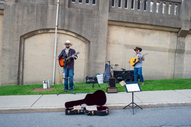 Festivalgoers enjoy food, music, and the atmosphere as they gather ahead of the evening's headlining performance during Musikfest on Saturday, Aug. 8, 2026, in Bethlehem. The annual festival runs through Aug. 9. (Jonathan Broady/Special to The Morning Call)
