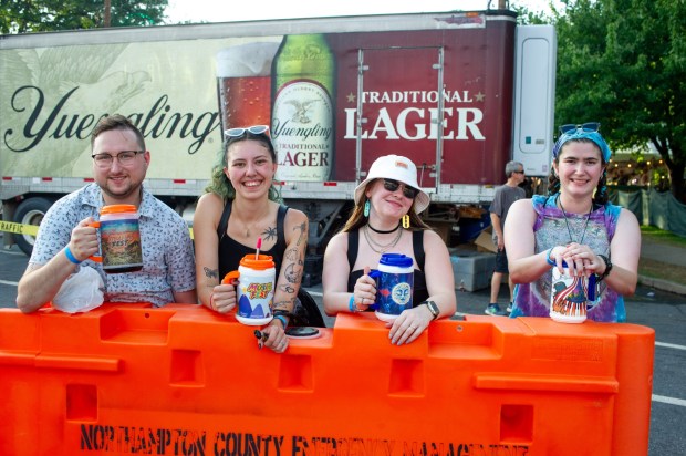 Festivalgoers enjoy food, music, and the atmosphere as they gather ahead of the evening's headlining performance during Musikfest on Saturday, Aug. 8, 2026, in Bethlehem. The annual festival runs through Aug. 9. (Jonathan Broady/Special to The Morning Call)