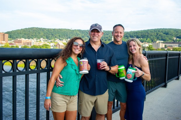 Festivalgoers enjoy food, music, and the atmosphere as they gather ahead of the evening's headlining performance during Musikfest on Saturday, Aug. 8, 2026, in Bethlehem. The annual festival runs through Aug. 9. (Jonathan Broady/Special to The Morning Call)