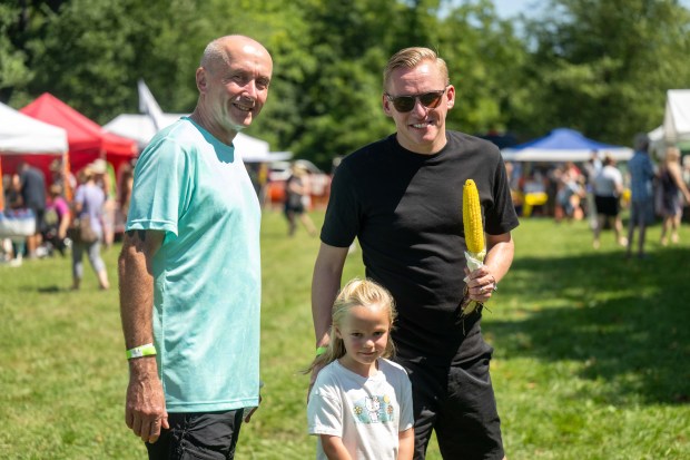 Kevin, Penny and Kevin Kellet from the UK stop for a picture on Saturday, Aug. 15, 2026, during the 46th annual Roasting Ears of Corn Festival hosted by the Museum of Indian Culture in Allentown. The event features Native American drumming, singing, dancing, food, artisans, cultural heritage activities and more. The event runs through Sunday from 10 a.m. to 6 p.m. (Jonathan Broady/Special to The Morning Call)