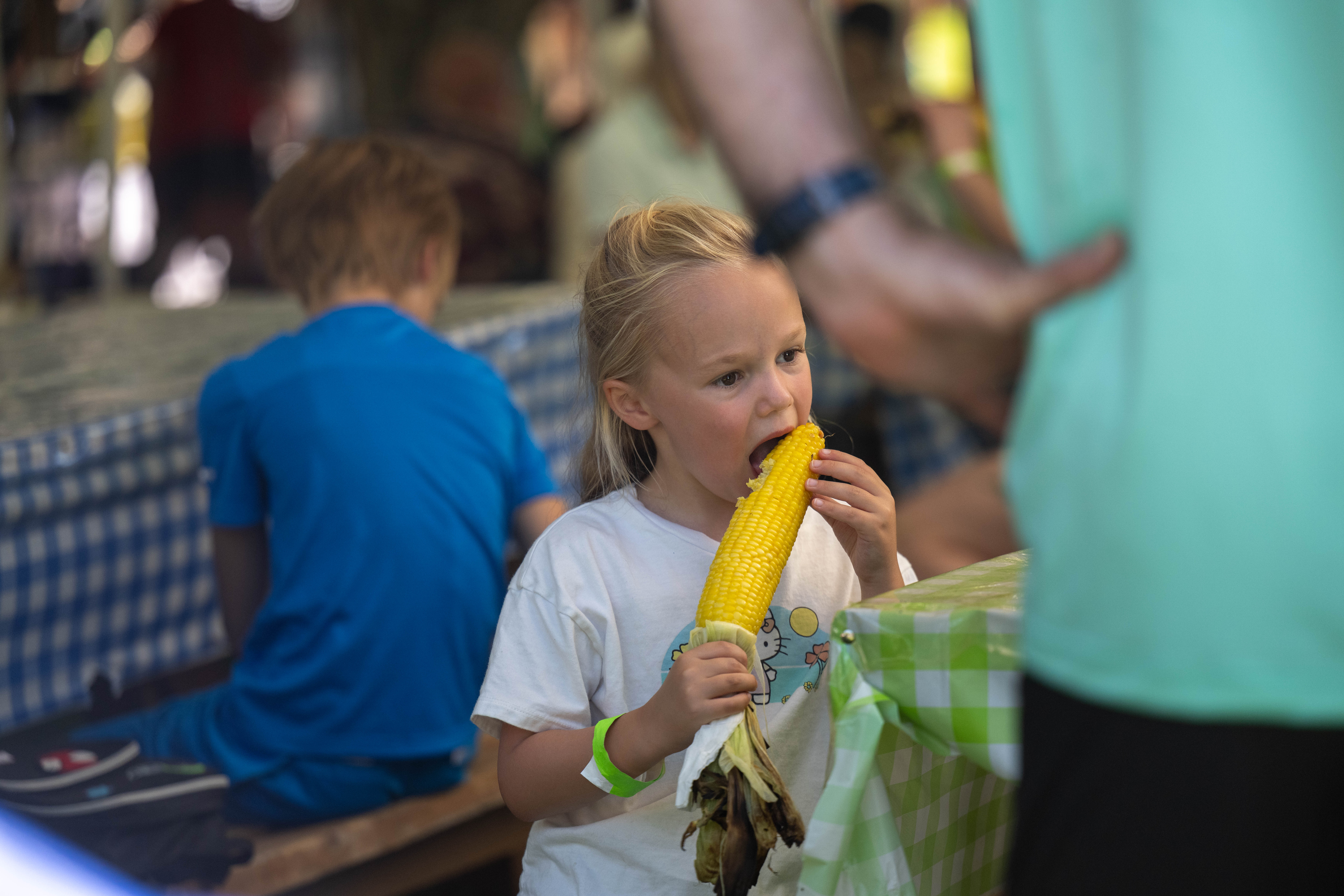 Penny Kellet from the UK enjoys corn on the cob on Saturday, Aug. 15, 2026, during the 46th annual Roasting Ears of Corn Festival hosted by the Museum of Indian Culture in Allentown. The event features Native American drumming, singing, dancing, food, artisans, cultural heritage activities and more. The event runs through Sunday from 10 a.m. to 6 p.m. (Jonathan Broady/Special to The Morning Call)