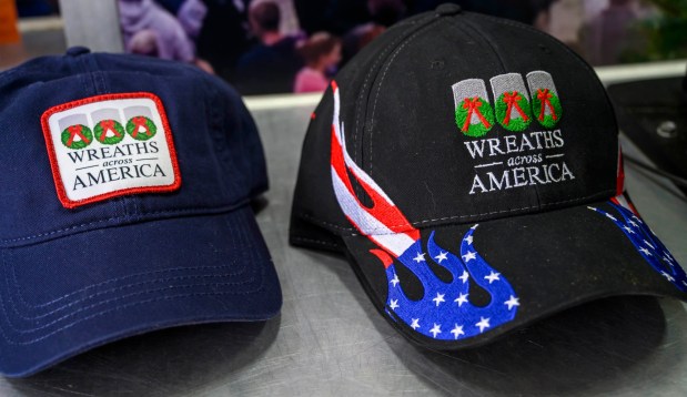 Hats are for sale at Wreaths Across America's Mobile Education Exhibit on Thursday, Aug. 27, 2026, at Mission BBQ in Whitehall Township. During August and Early September, the exhibit is traveling around the state to honor service members and educate the local community. It will be at Mission BBQ again 11 a.m. to 54 p.m. Aug. 28; at Nam Knights Vet Fest in Northampton 10 a.m. to 5 p.m. Aug. 29; St. Luke's-West End in Allentown 9 a.m. to 4 p.m. Aug. 31, and at Miller-Keystone Blood Center in Bethlehem noon to 6 p.m. Sept. 1. (April Gamiz/The Morning Call)