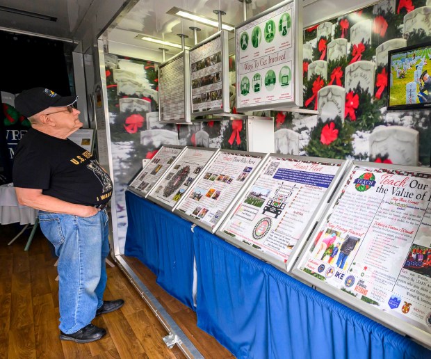 Army veteran Barry Miller of North Whitehall Township looks at Wreaths Across America's Mobile Education Exhibit on Thursday, Aug. 27, 2026, at Mission BBQ in Whitehall Township. During August and Early September, the exhibit is traveling around the state to honor service members and educate the local community. It will be at Mission BBQ again 11 a.m. to 54 p.m. Aug. 28; at Nam Knights Vet Fest in Northampton 10 a.m. to 5 p.m. Aug. 29; St. Luke's-West End in Allentown 9 a.m. to 4 p.m. Aug. 31, and at Miller-Keystone Blood Center in Bethlehem noon to 6 p.m. Sept. 1. (April Gamiz/The Morning Call)