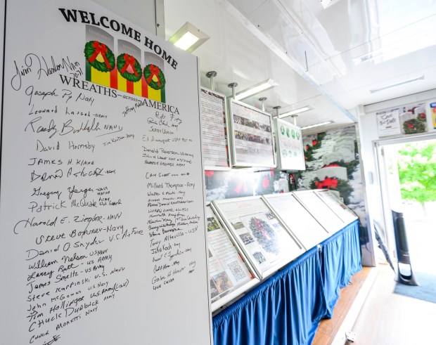 Signatures of Vietnam veterans who have visited Wreaths Across America's Mobile Education Exhibit are on display Thursday, Aug. 27, 2026, at Mission BBQ in Whitehall Township. During August and Early September, the exhibit is traveling around the state to honor service members and educate the local community. It will be at Mission BBQ again 11 a.m. to 54 p.m. Aug. 28; at Nam Knights Vet Fest in Northampton 10 a.m. to 5 p.m. Aug. 29; St. Luke's-West End in Allentown 9 a.m. to 4 p.m. Aug. 31, and at Miller-Keystone Blood Center in Bethlehem noon to 6 p.m. Sept. 1. (April Gamiz/The Morning Call)