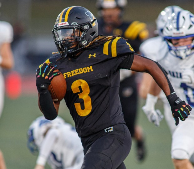 Freedom's Lashawn Johnson runs for yardage against Nazareth in a battle of two of the EPCs top teams Friday, Sept. 12, 2025, at Liberty High School in Bethlehem. (Jane Therese/Special to The Morning Call)