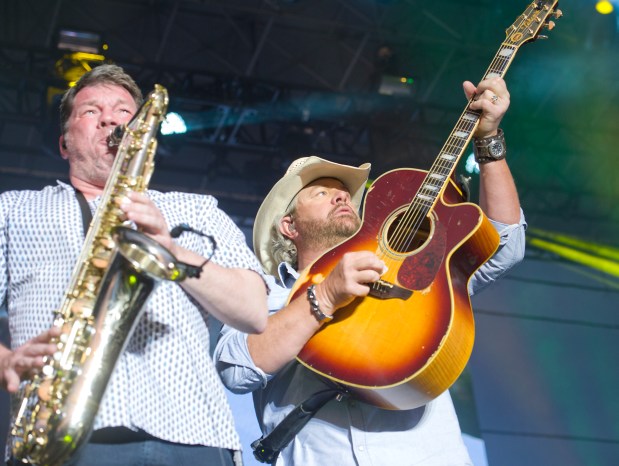 Roman Dudok performs on saxaphone (left) as Toby Keith headlines on the Sands Steel Stage at Musikfest on Thursday, August 10, 2017. /// (Harry Fisher / The Morning Call) mc-ent-review-musikfest-toby-keith-20170808