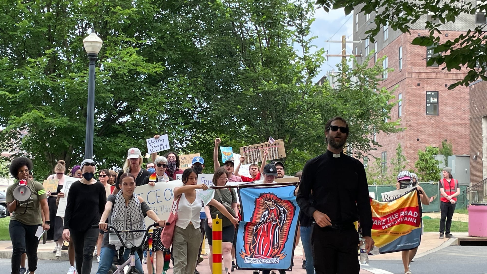Residents gathered at a rally in Bethlehem on Thursday, June 12 to protest a federal immigration raid at the fire-damaged Fiv