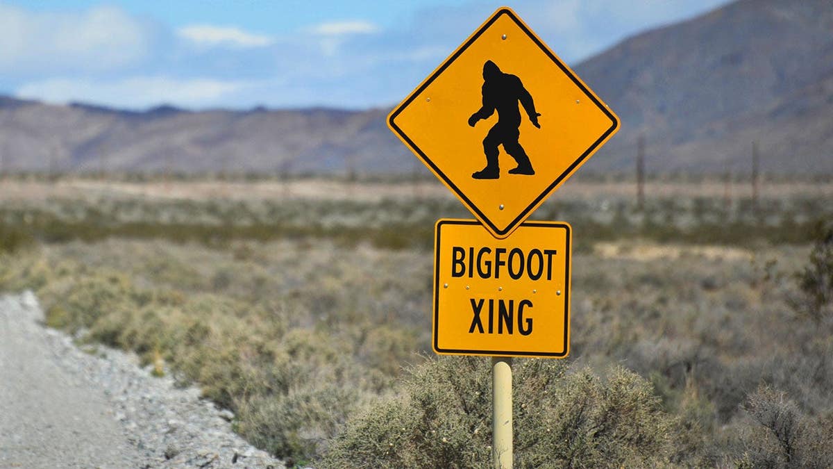 A comical traffic sign in the desert warning of bigfoot crossing