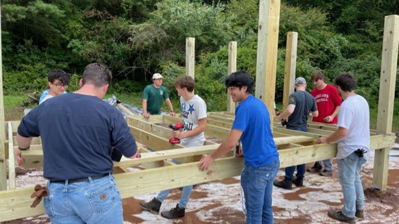 Engineering Ahead participants building a viewing platform they designed for the Nolde State Forest butterfly meadow.