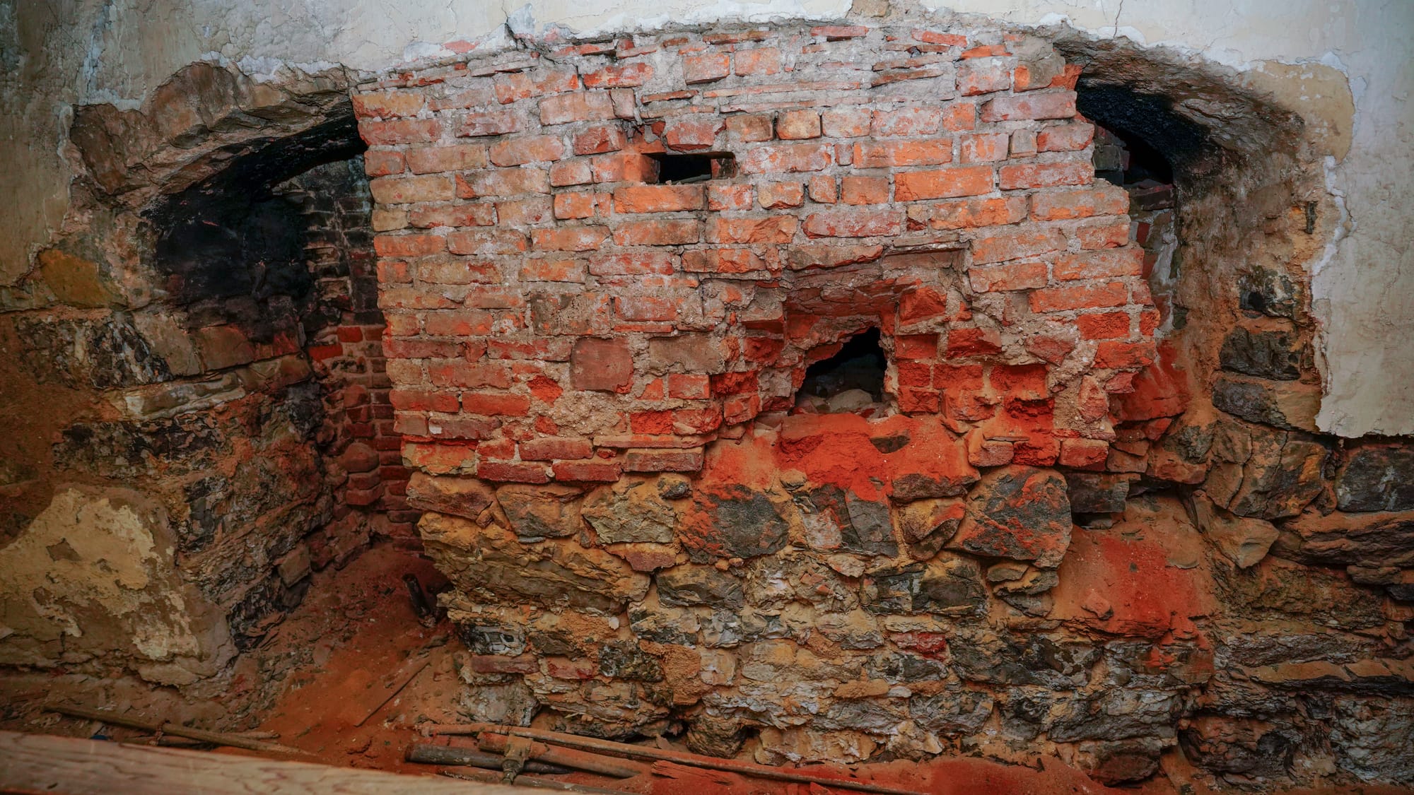 One of four large fireplaces that heated the Brethren House which was uncovered from under plaster possibly in the 1970s. Tou