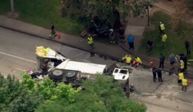 1 hospitalized after garbage truck overturns in multi-vehicle crash