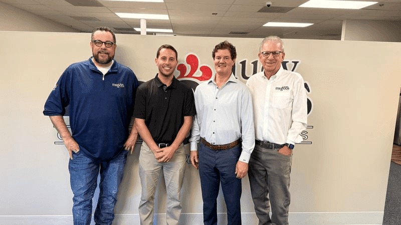 Left to right: Chief Operations Officer Mike Sutter; franchisee Mike Diskin; franchisee Mark DeStefano; CEO