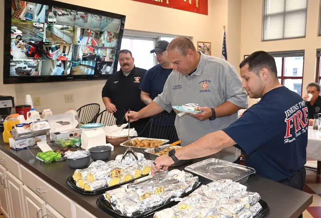 <p>First responders dig in on a breakfast provided by the Second Presbyterian Church, Pittston, at the City of Pittston Firehouse, in honor of the tragedy of 9-11.</p>
<p>Tony Callaio | For Sunday Dispatch</p>